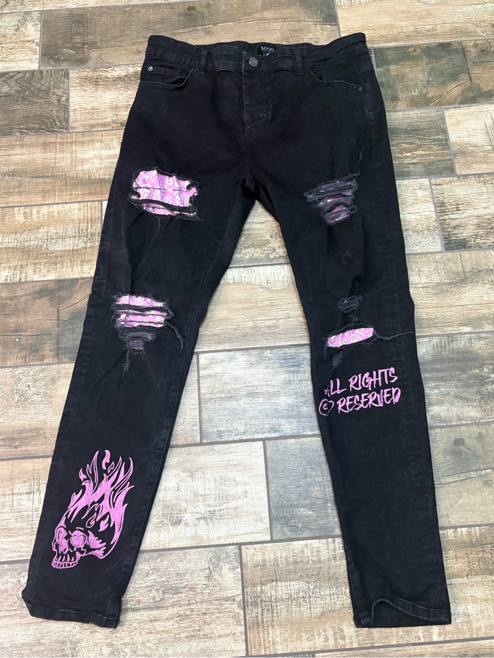 Black Distressed Men’s Jeans with Pink Graphic Detail